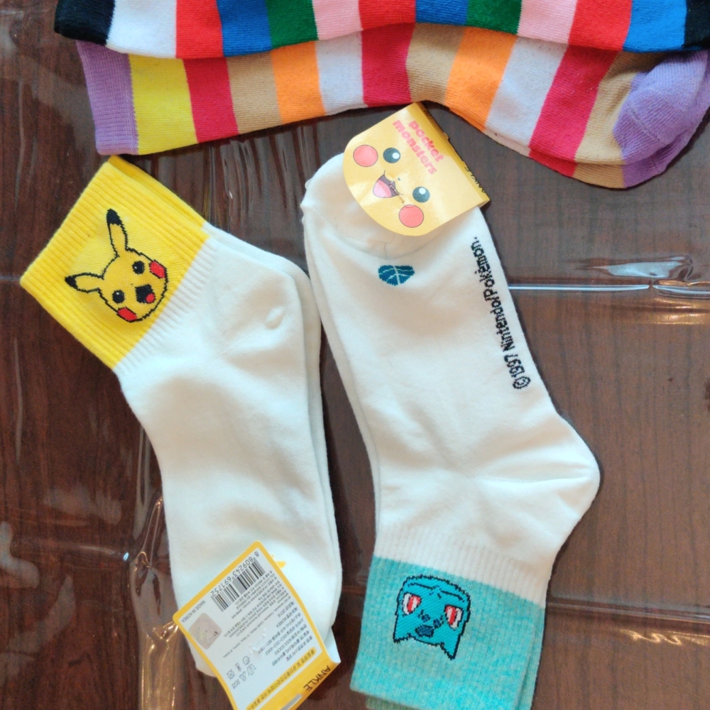 Bundle of Pokemon socks with bonus striped socks